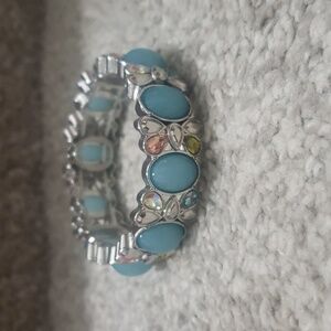 Butterfly charm with blue stone stretxh bracelet